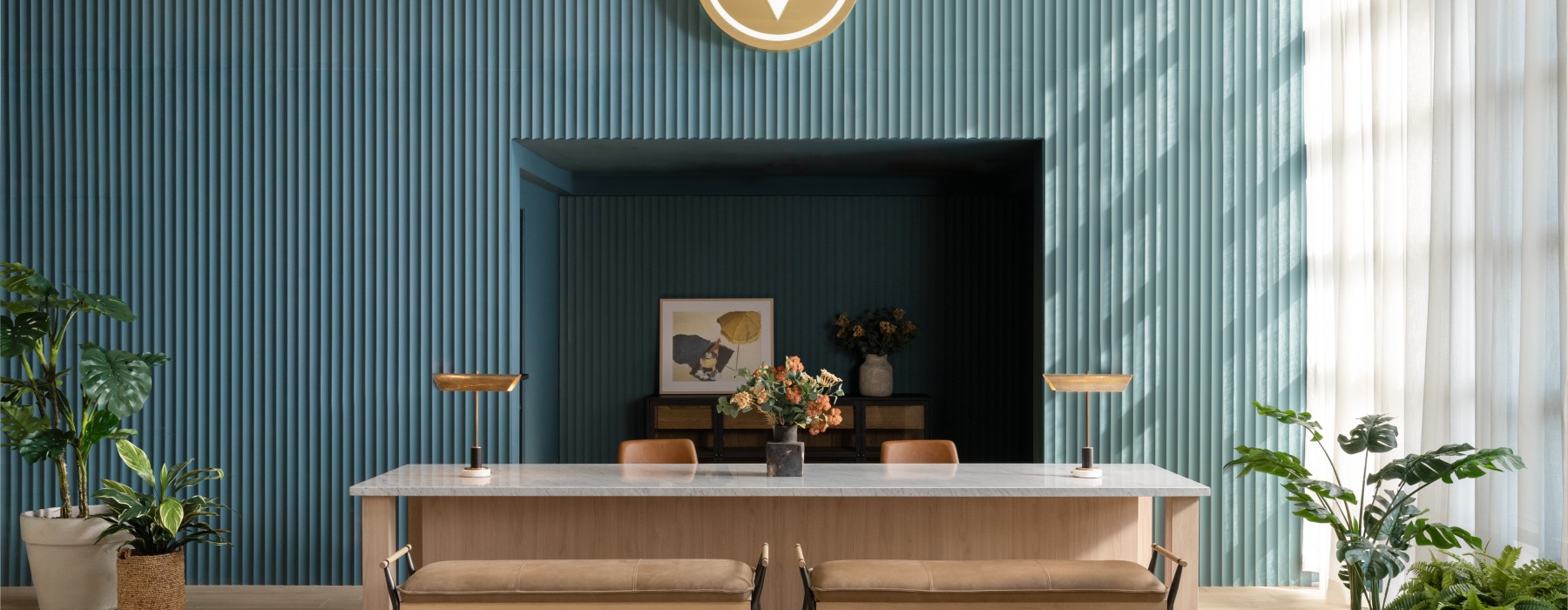 a leasing office front desk with a desk and benches