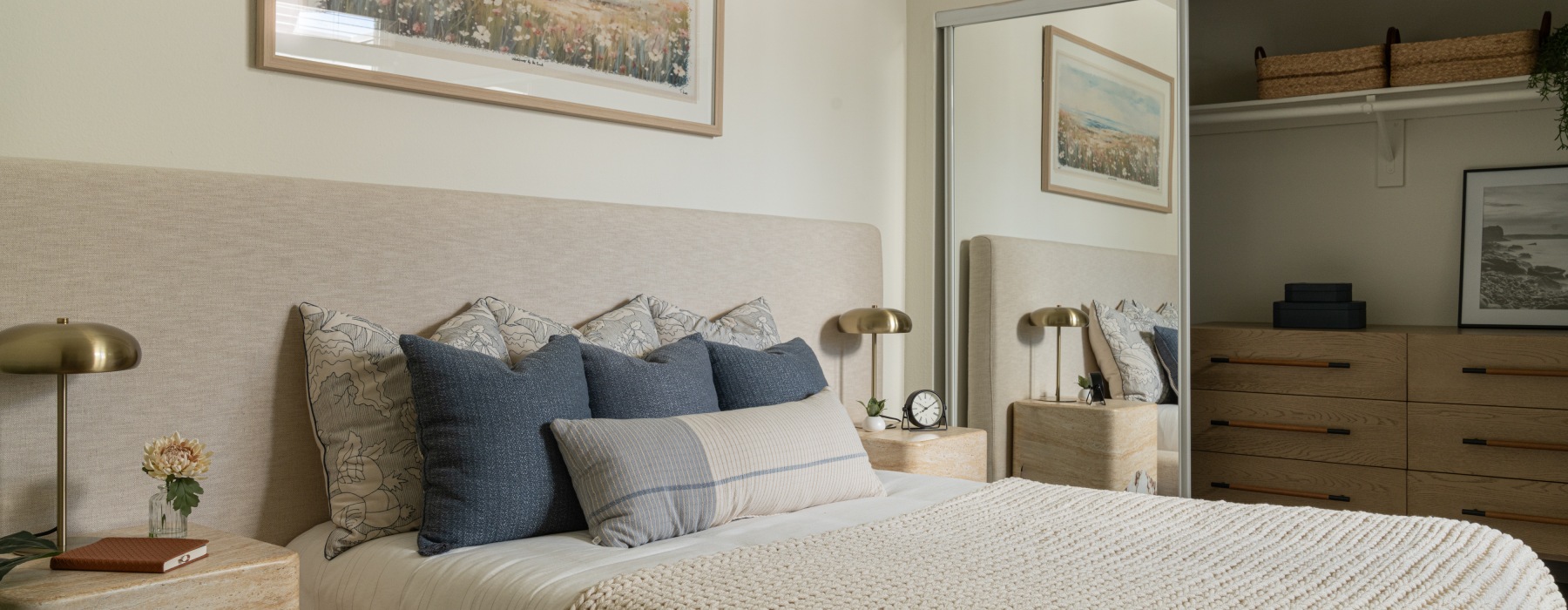 a bedroom with a bed and two nightstands