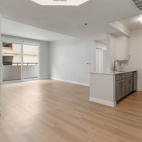 living room with wood floors and kitchen island